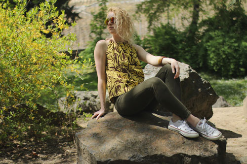 Woman is wearing yellow top with bamboo pattern