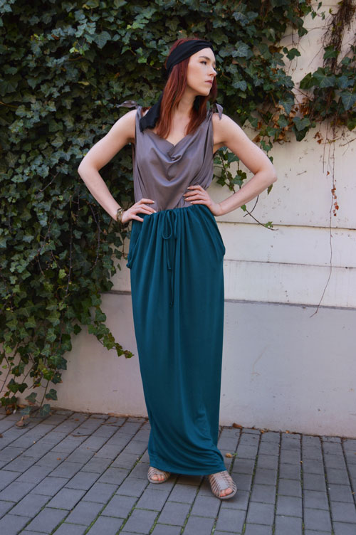 Model is wearing reversible long blue green skirt with pockets