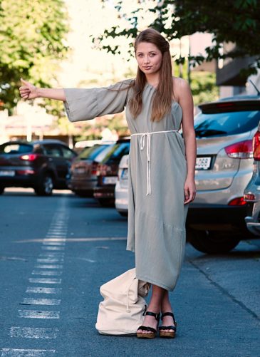 Light green semi long reversible dress with one sleewe and naked shoulder Model is wearing reversible pale green midi dress with one sleeve
