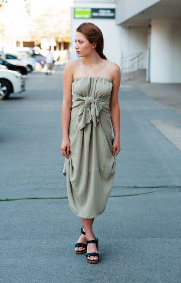 Light green strapless reversible dress Model is wearing pale green midi strapless dress with bow in front